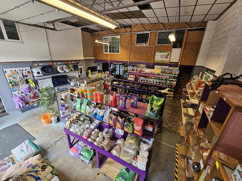 Inside Palin & Way Pet Supplies: stocked shelves of pet food, bedding, toys and accessories